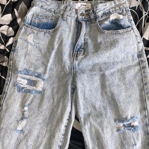 light wash mom jeans with rips in them
